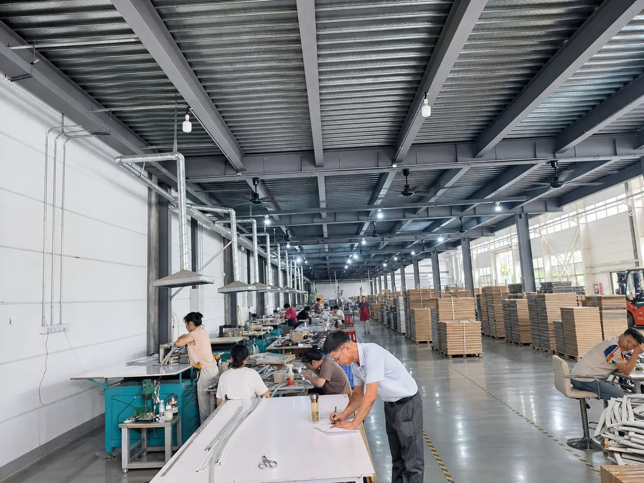Workers assembling and checking gasket profiles inside Gaojia factory